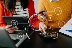 working-team-meeting-concept-business-using-laptop-and-smart-phone-and-digital-tablet-computer-with-digital-marketing-media-in-virtual-icon-network-diagram-office-in-morning-light-photo